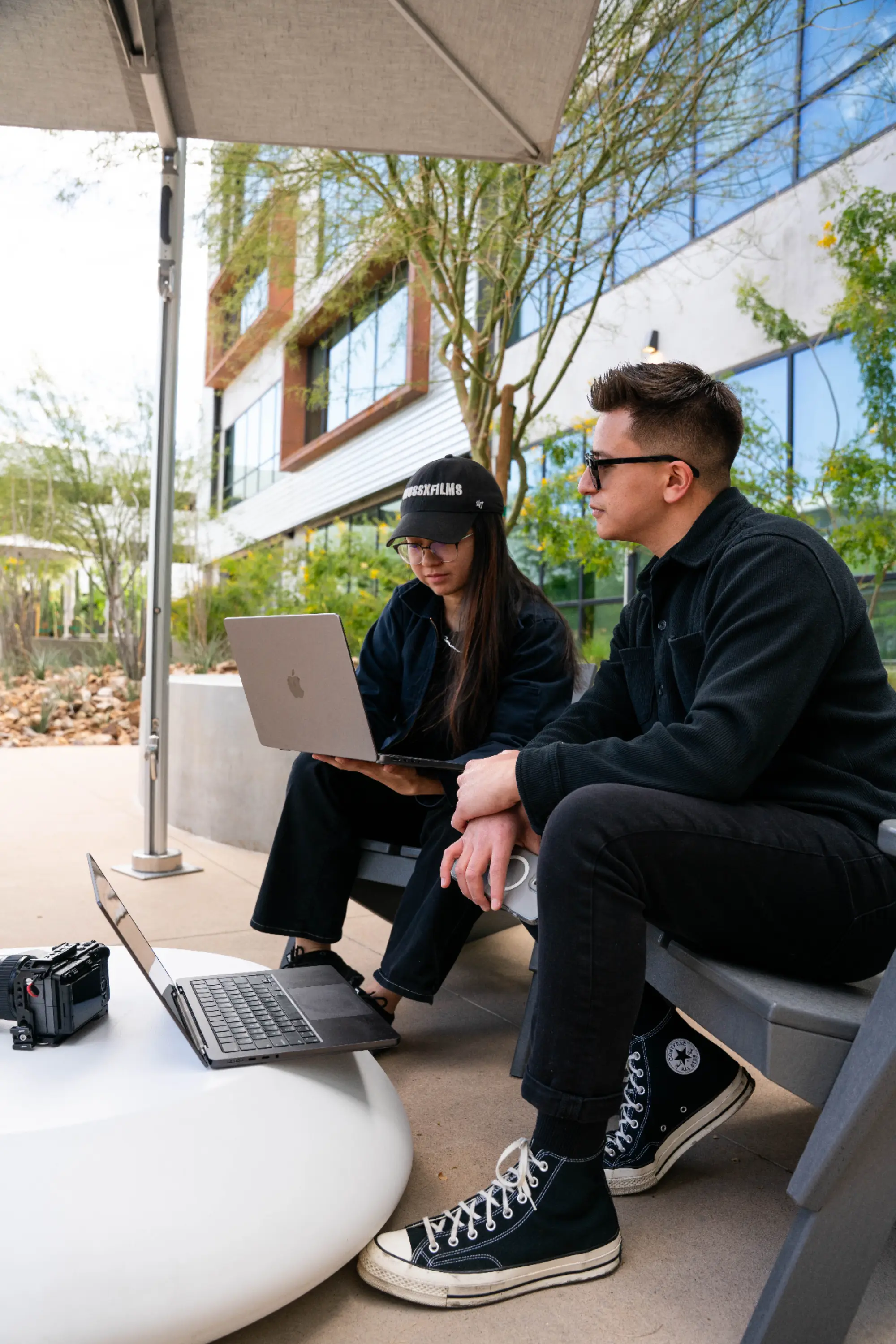 Melina and Christian, co-founders of Cross X Agency, reviewing work on location in Las Vegas