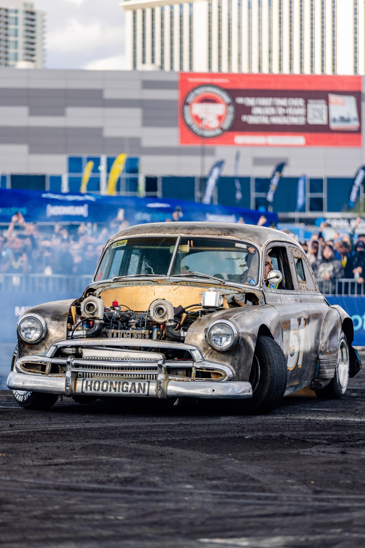 Twin-turbo Hoonigan rat rod doing a burnout outside the Las Vegas Convention Center during the show week