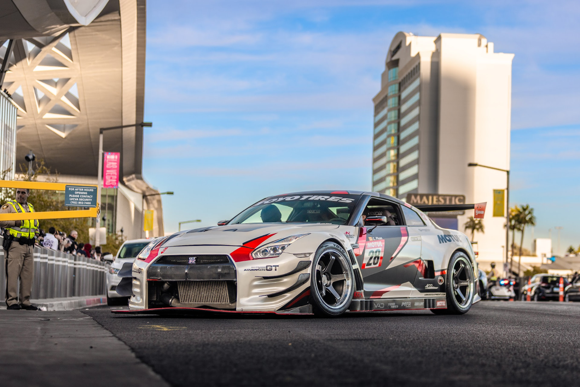 White widebody Nissan GT-R on Advan wheels rolling out of the Las Vegas Convention Center during the SEMA Show cruise